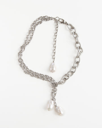 Silver Rain necklace from Jewell Reef displayed on a white background, featuring layered jewelry steel chains and baroque pearls.