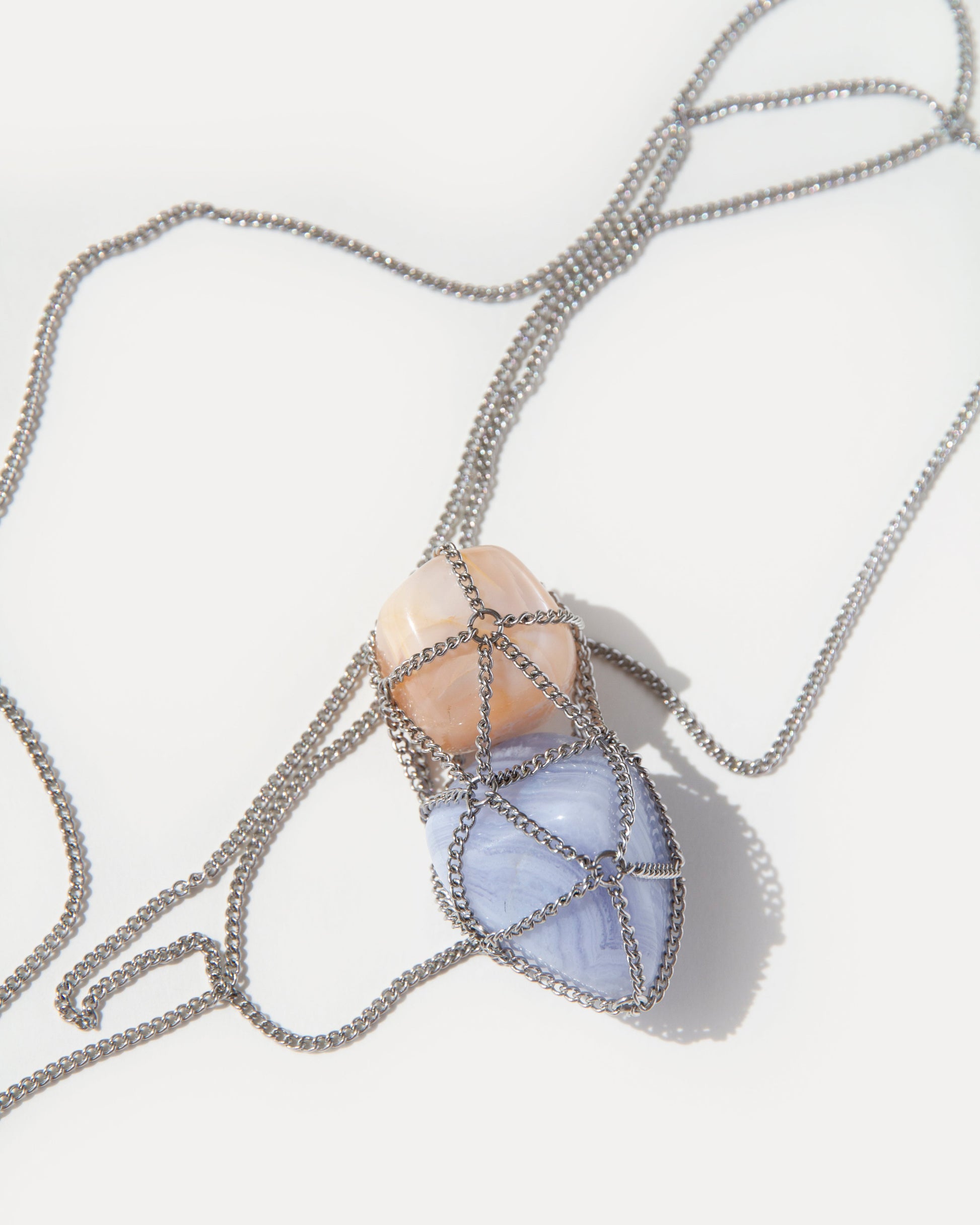 Angel Skin Necklace pendant featuring warm sunstone and soft blue lace agate on a steel chain