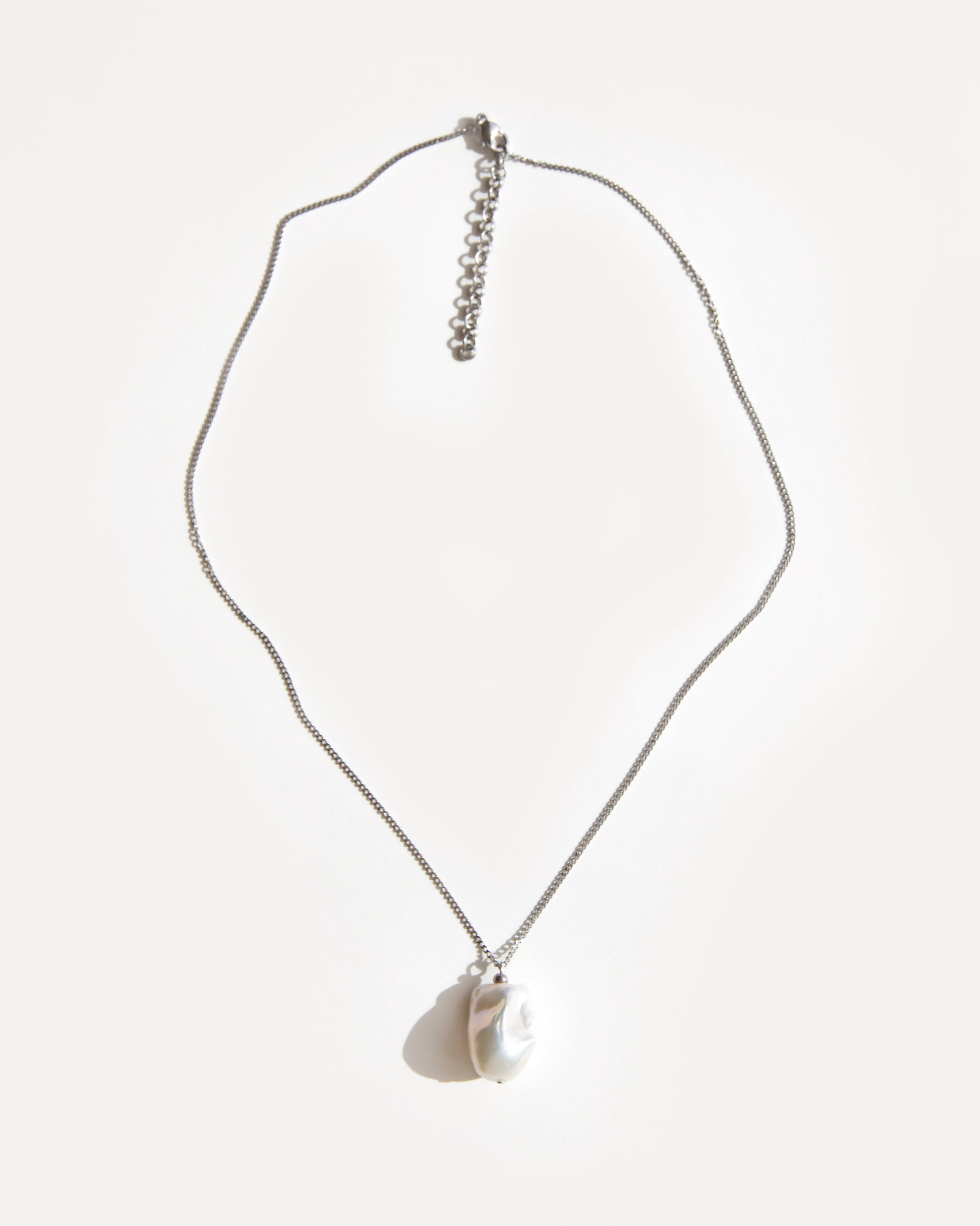 Baroque freshwater pearl pendant necklace on stainless steel chain with adjustable extender, minimalist and elegant everyday jewelry.