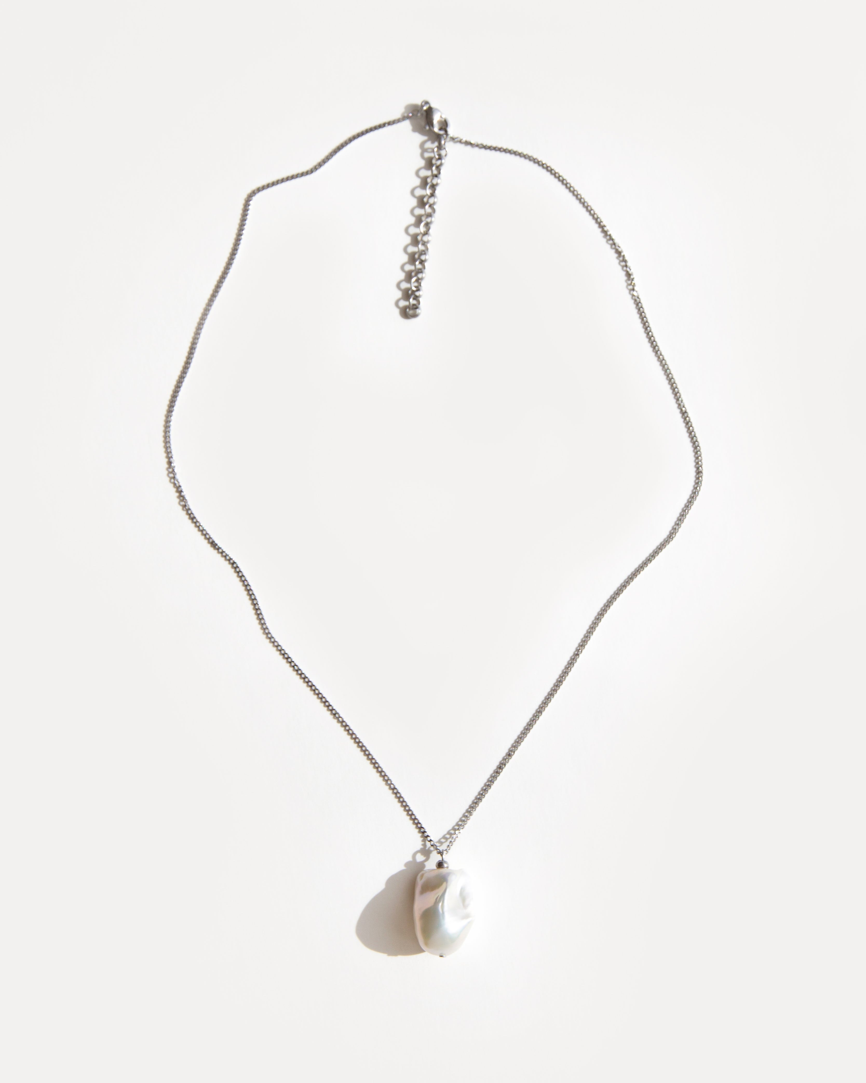 Baroque freshwater pearl pendant necklace on stainless steel chain with adjustable extender, minimalist and elegant everyday jewelry.