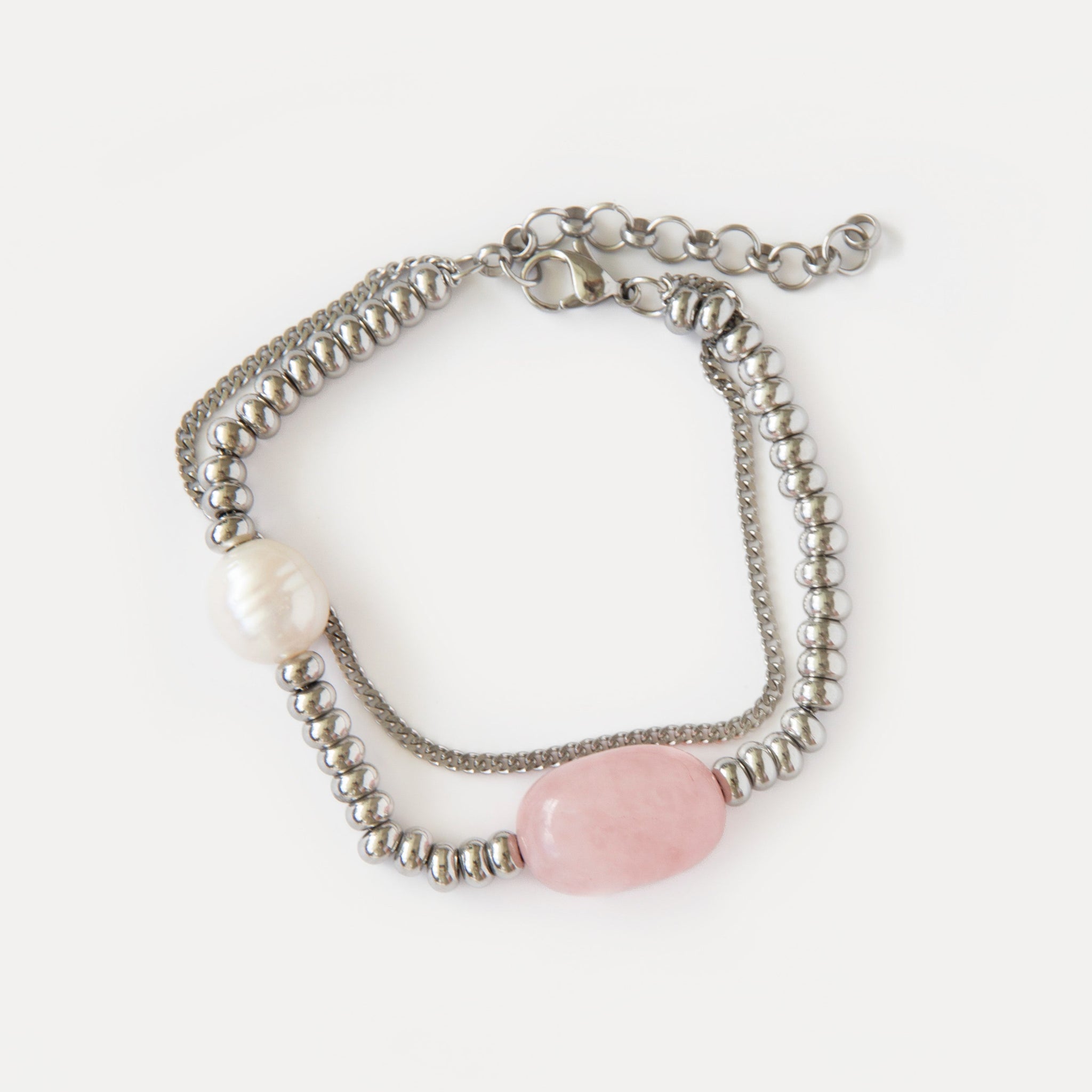 Candy Bracelet with rose quartz, freshwater pearl, and polished stainless steel beads — a minimalist silver-tone design with soft pink accents.