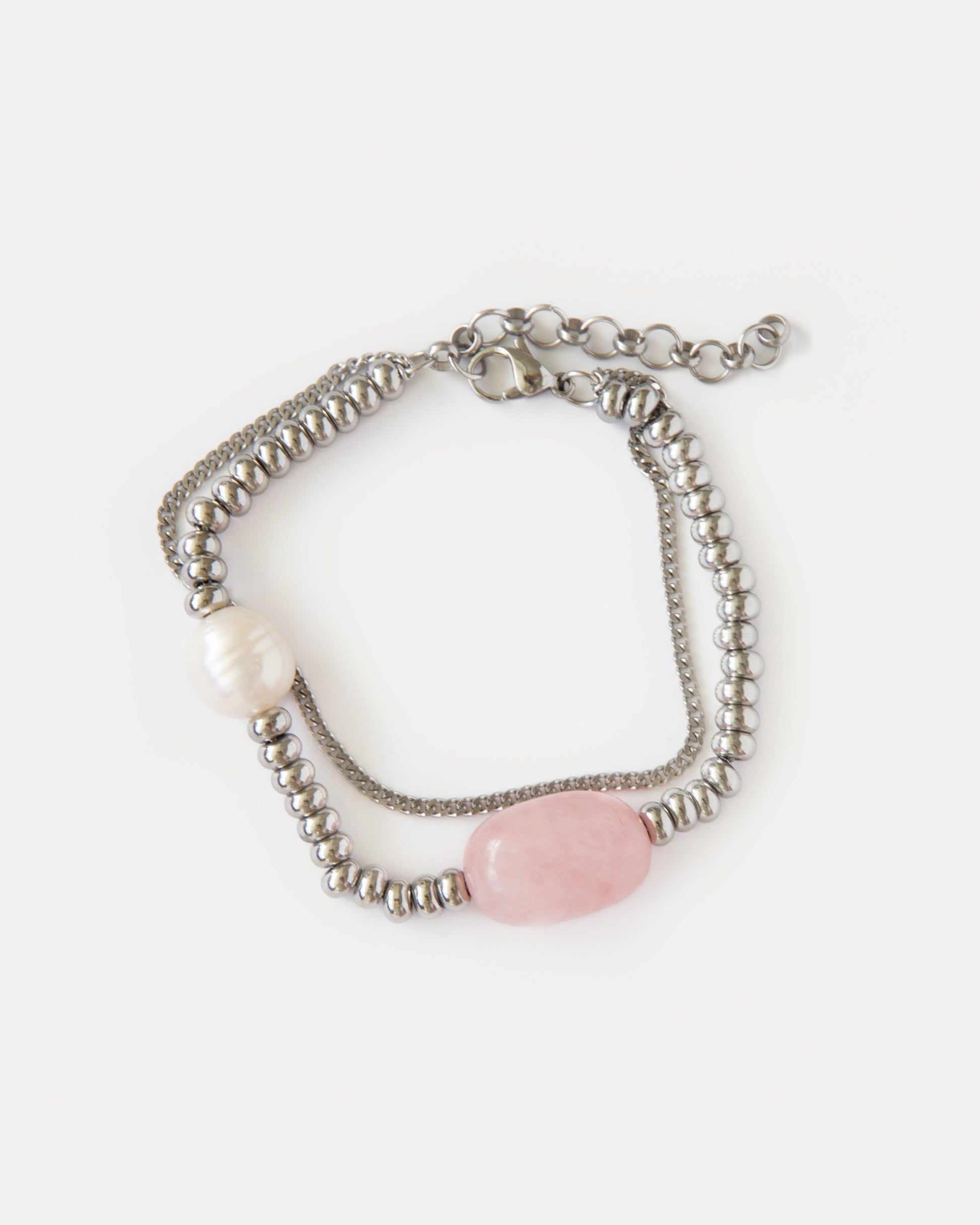Candy Bracelet with rose quartz, freshwater pearl, and polished stainless steel beads — a minimalist silver-tone design with soft pink accents.