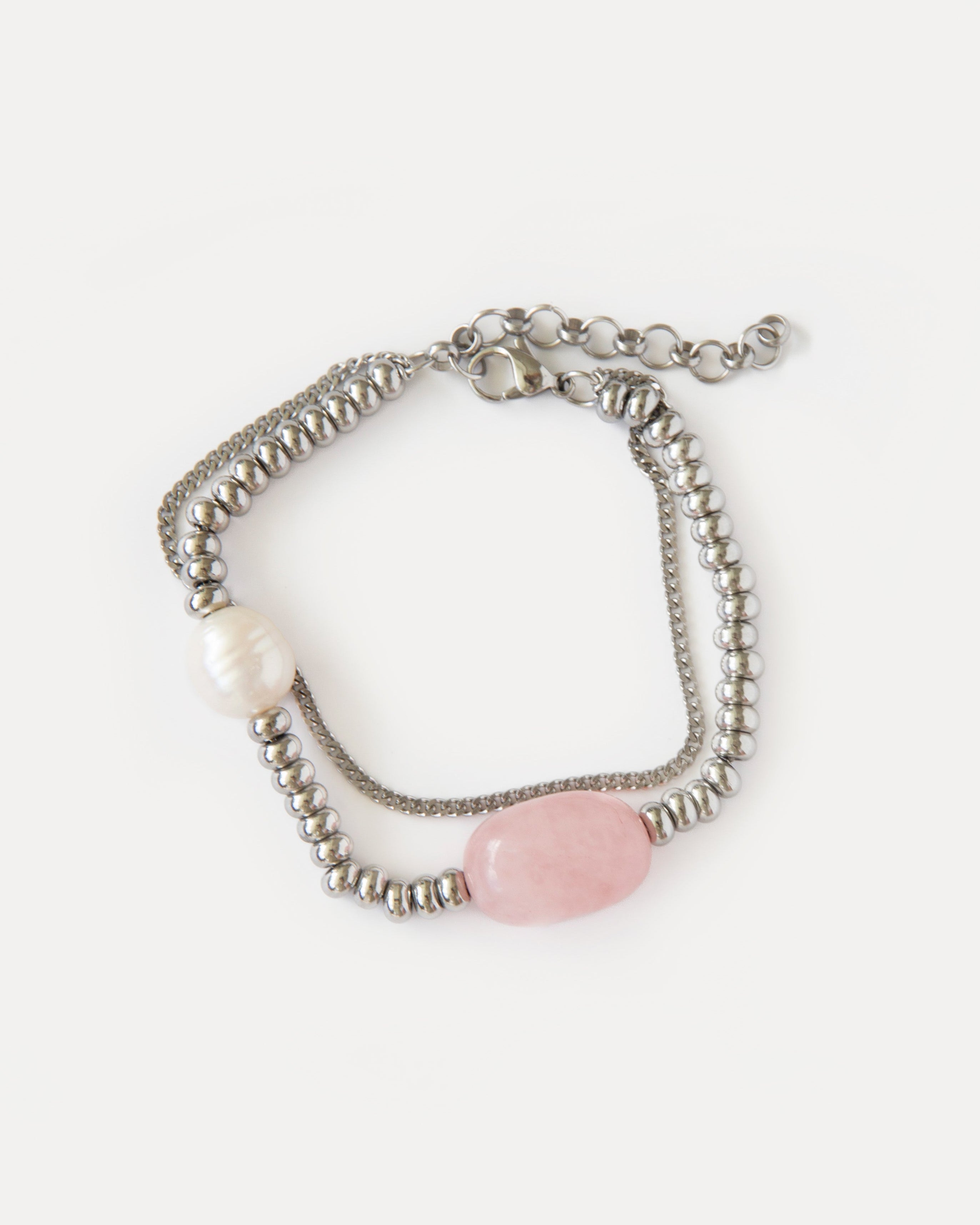 Candy Bracelet with rose quartz, freshwater pearl, and polished stainless steel beads — a minimalist silver-tone design with soft pink accents.