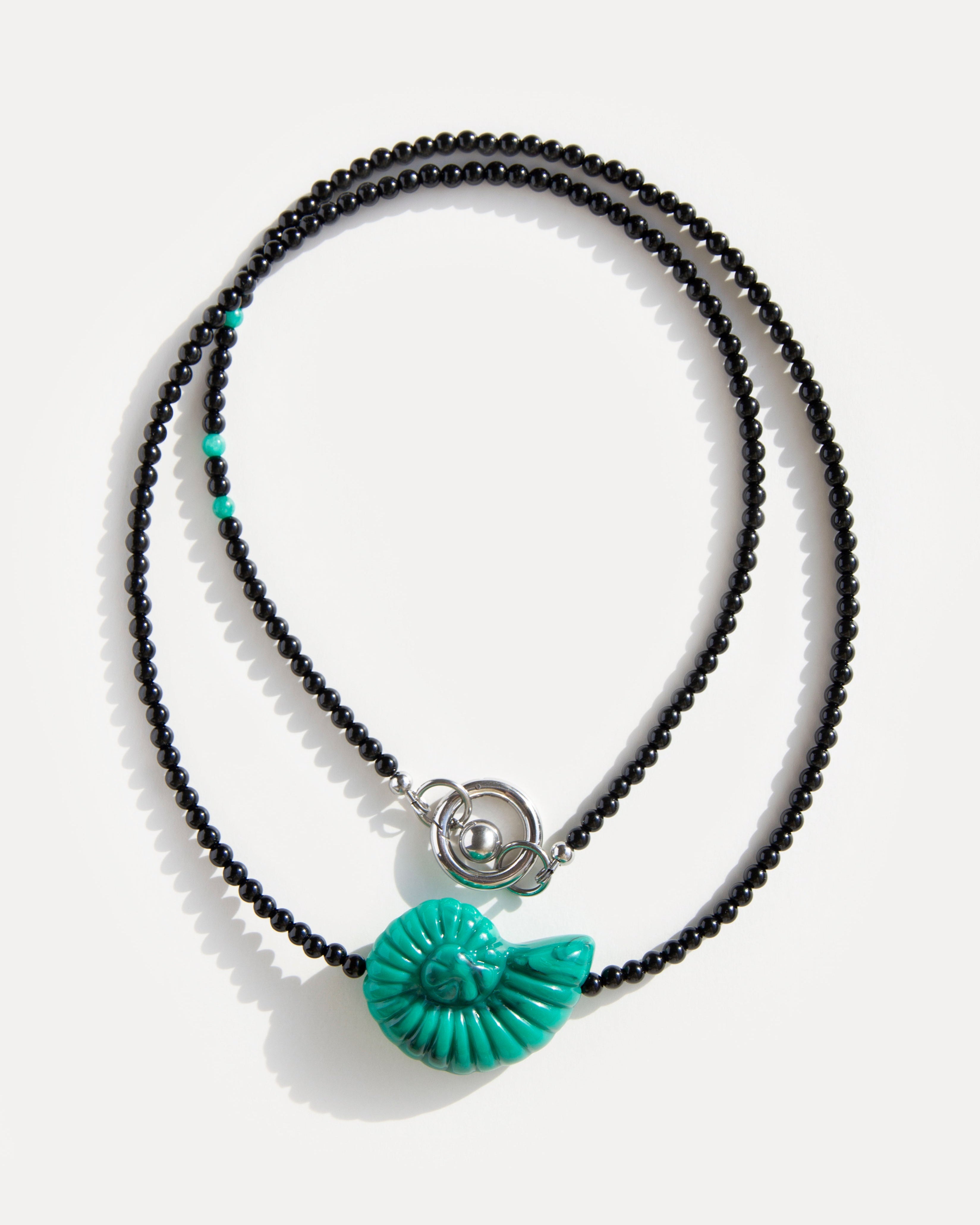 Emerald Shell Necklace with black agate beads, amazonite accents, and sculptural green shell pendant, handmade by Jewell Reef.
