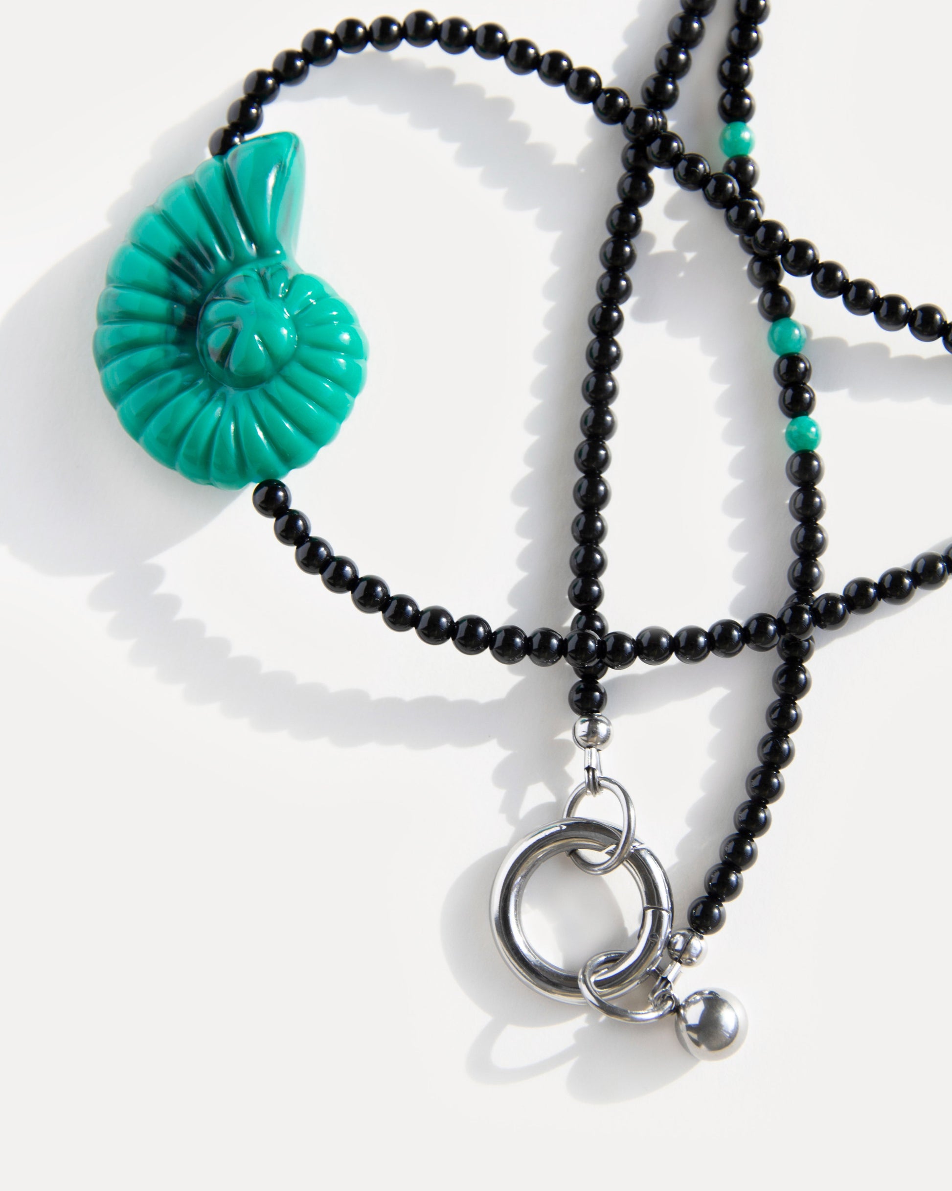 Emerald Shell Necklace with green shell pendant, black agate beads and amazonite details, finished with a stainless steel clasp – handmade jewelry by Jewell Reef
