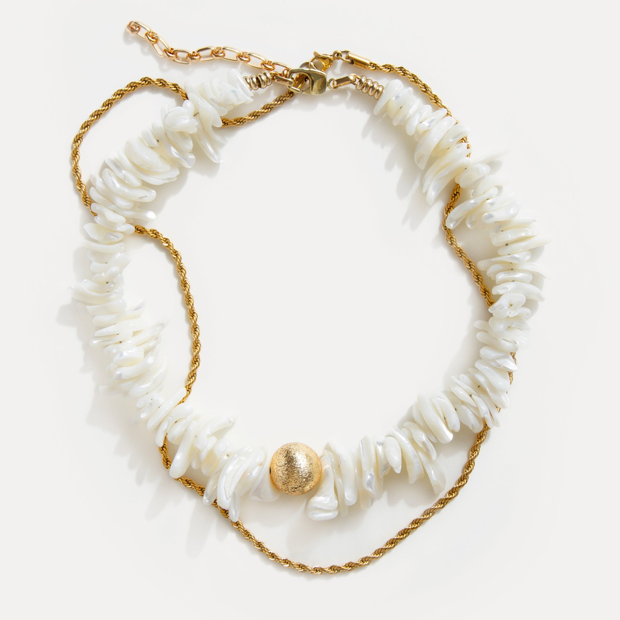 Fiesta Gold Necklace with natural shell beads and twisted 18k gold-plated chain on white background