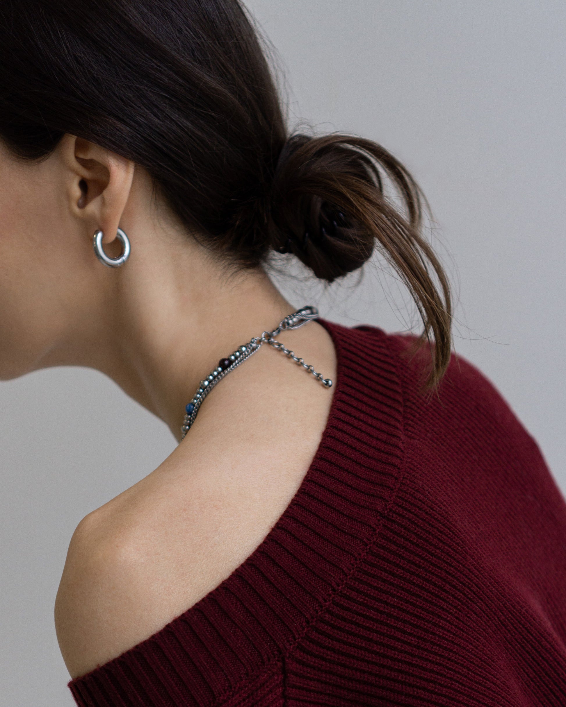 Side view of GEMS Necklace - minimalist layered beaded necklace with natural gemstones and sleek stainless steel chains.