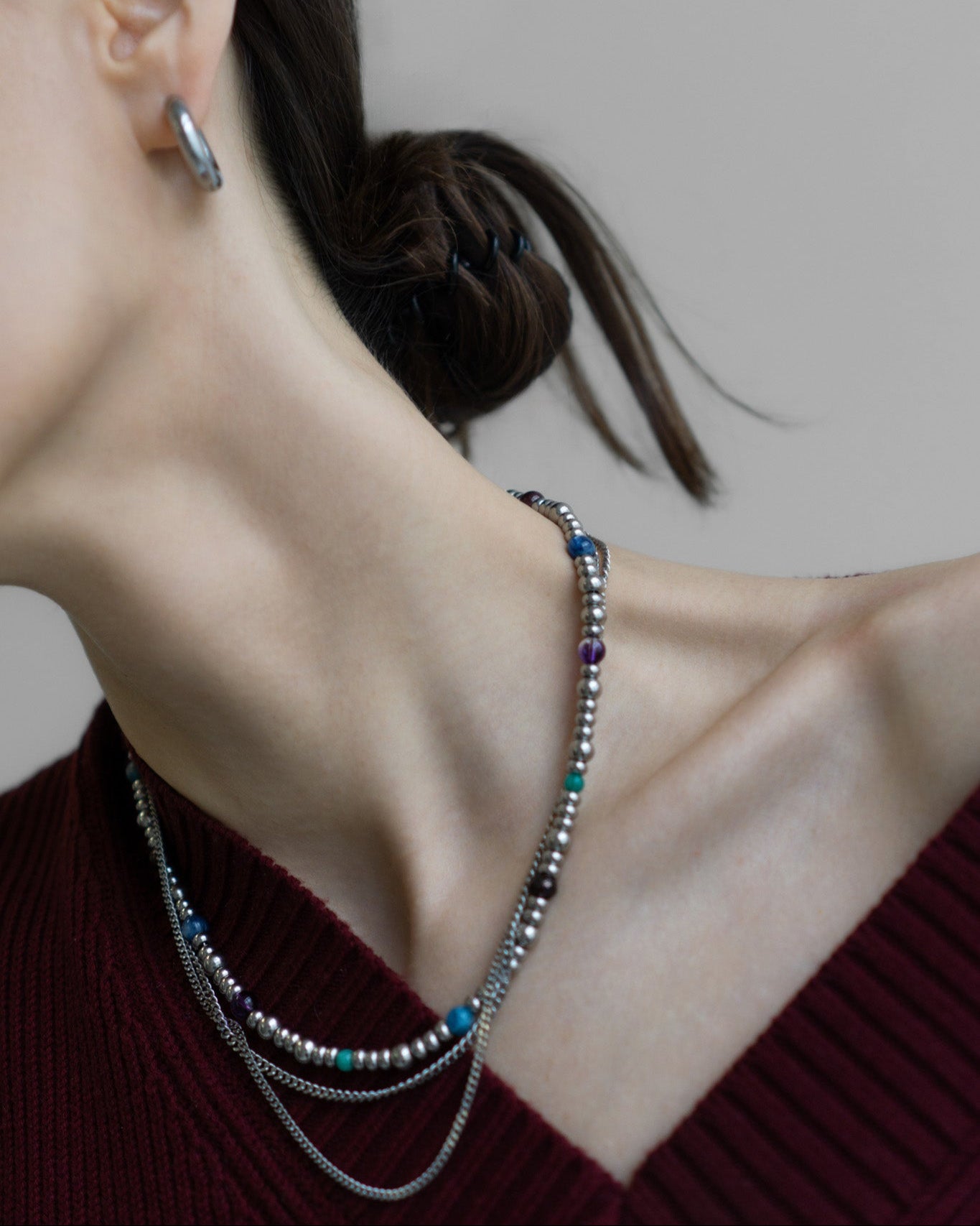 GEMS Necklace by Jewell Reef - layered beaded necklace with colorful gemstones and silver chains. Features garnet, amethyst, kyanite, amazonite, and apatite.