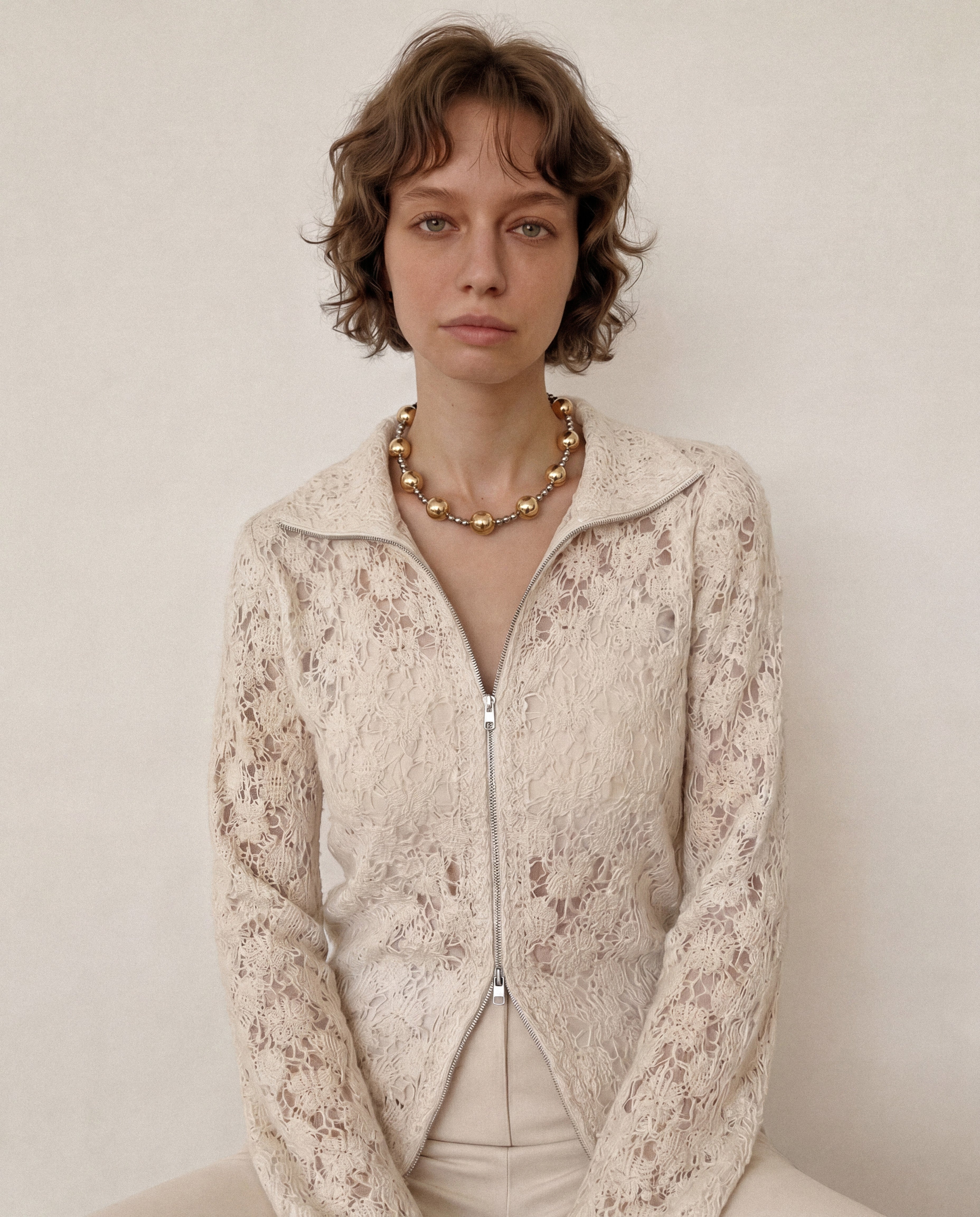 chunky mixed metal beaded necklace with gold and silver beads on model, styled with a light textured top for a soft, balanced look