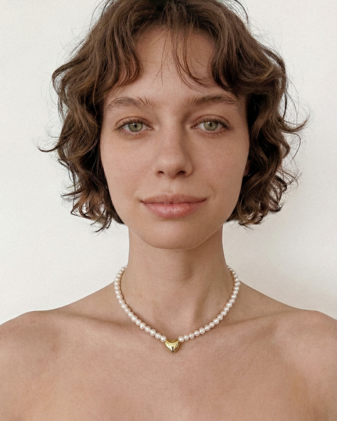 Freshwater pearl choker necklace with 18k gold plated heart charm, minimalist pearl necklace with extender chain on neutral background