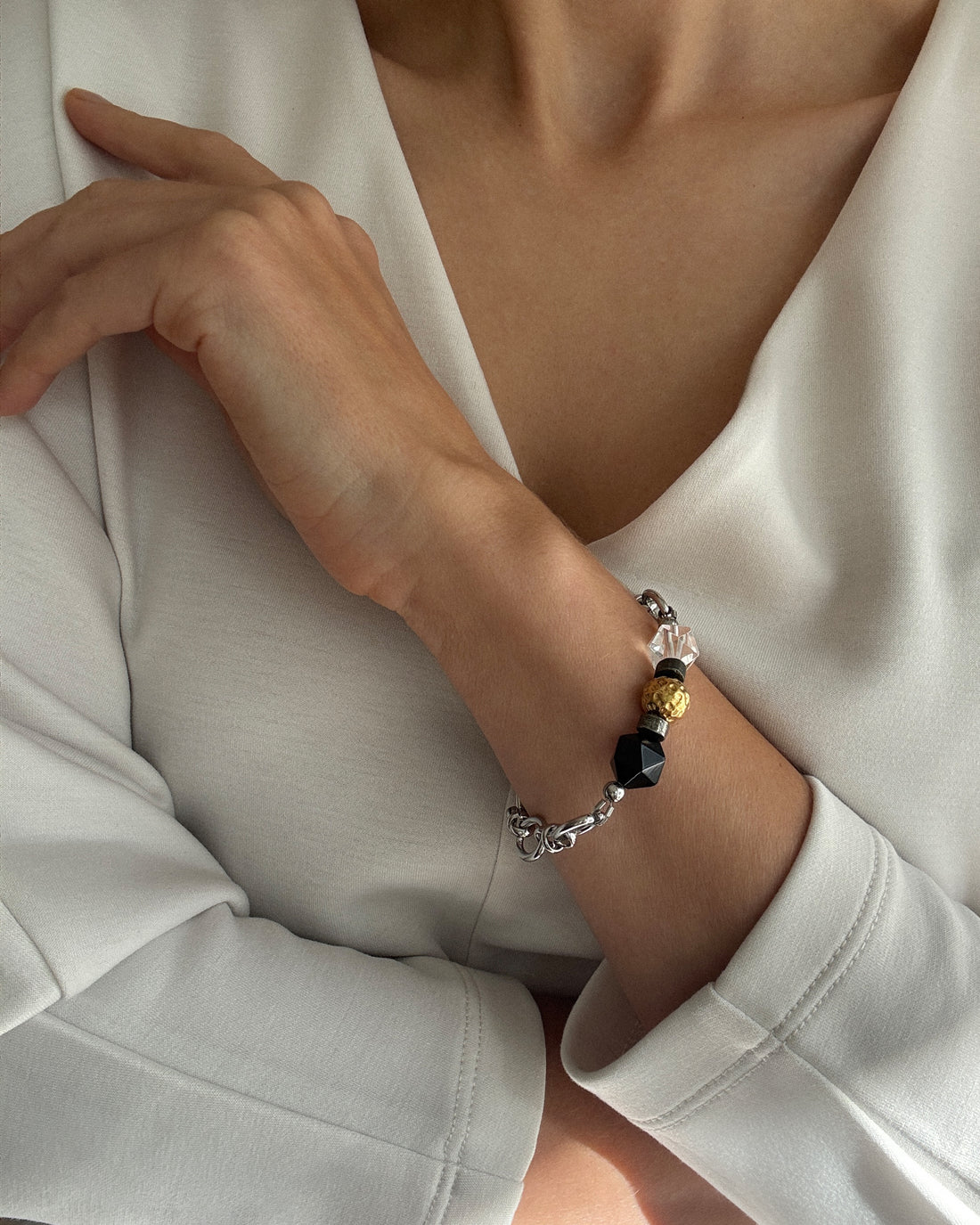 Jazz Bracelet with stainless steel chain, clear quartz, black agate, hematite, and an 18k gold-plated bead, modern minimalist jewelry. 