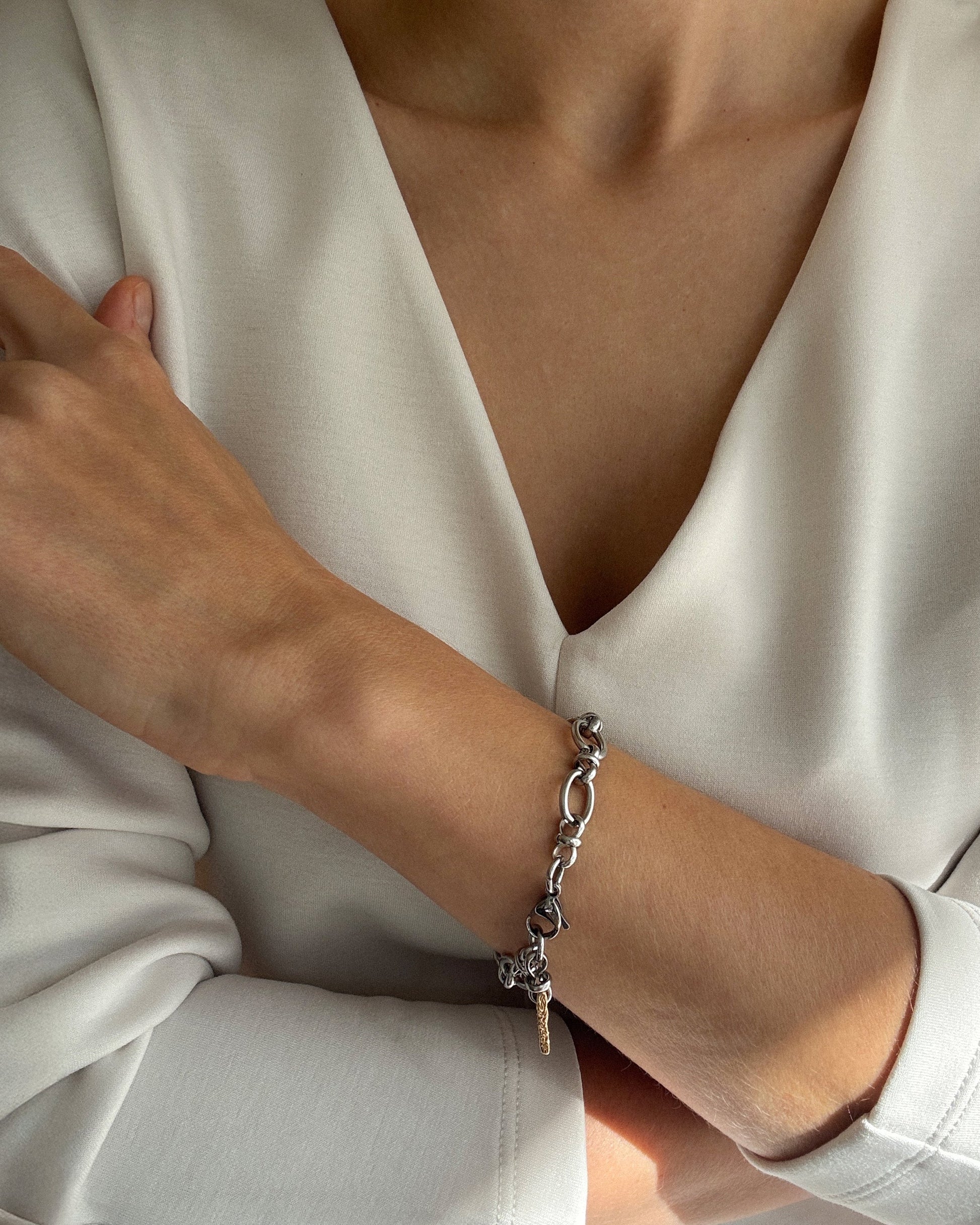 Minimalist Jazz Bracelet in stainless steel with natural stones and 18K gold-plated bead styled on wrist, modern everyday jewelry look