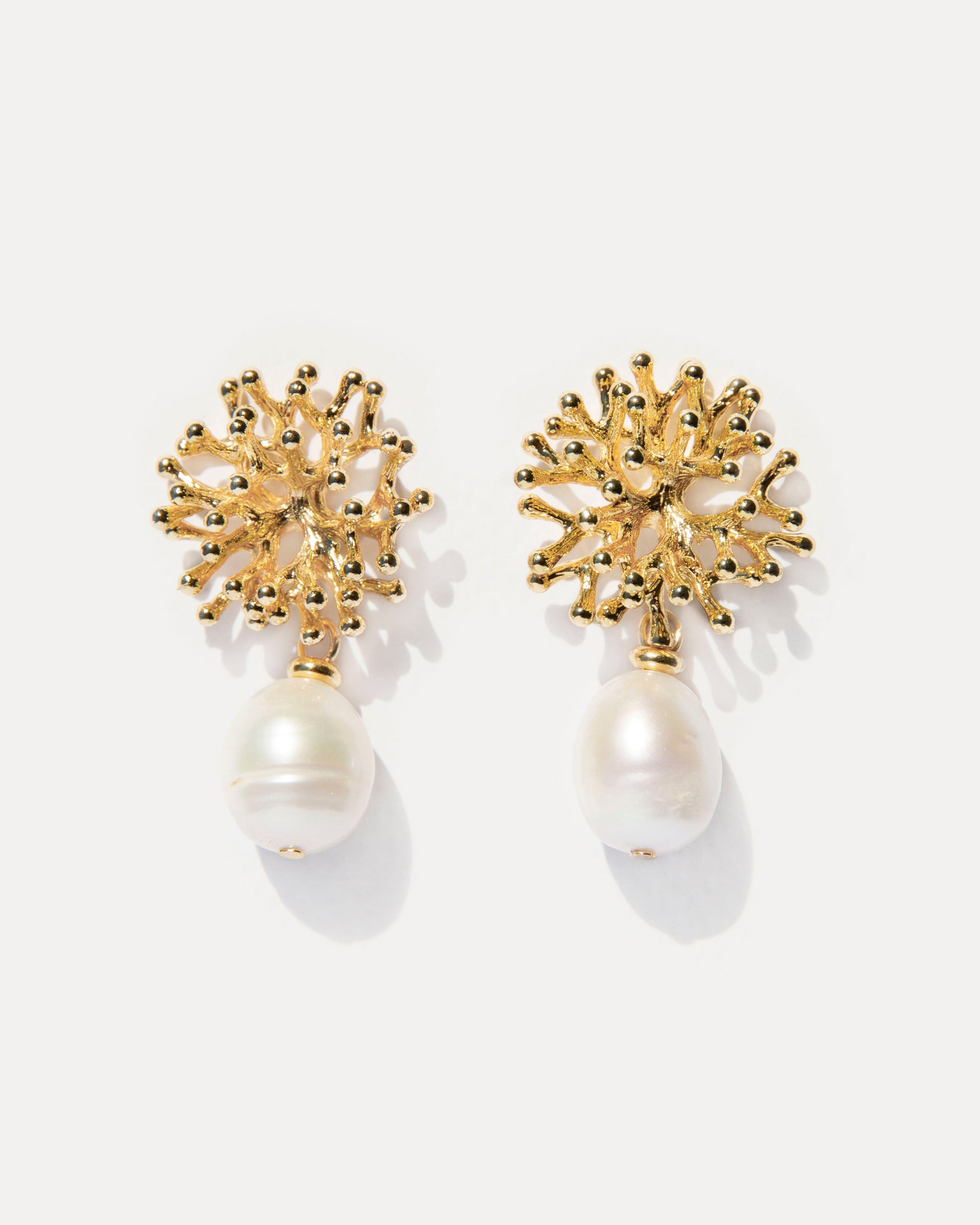 Mermaid’s Secret Earrings — 18K gold-plated coral shaped studs with natural freshwater pearls, capturing organic elegance and soft ocean light.