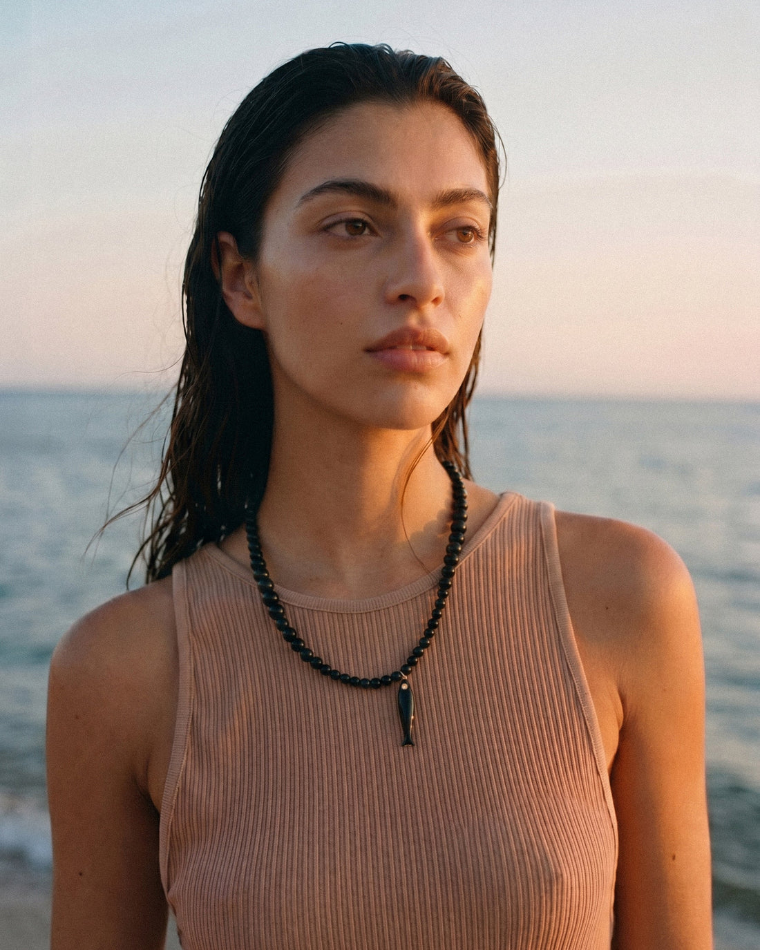 Black agate necklace with ceramic fish pendant and gold details, asymmetrical adjustable choker inspired by evening swims and coastal style