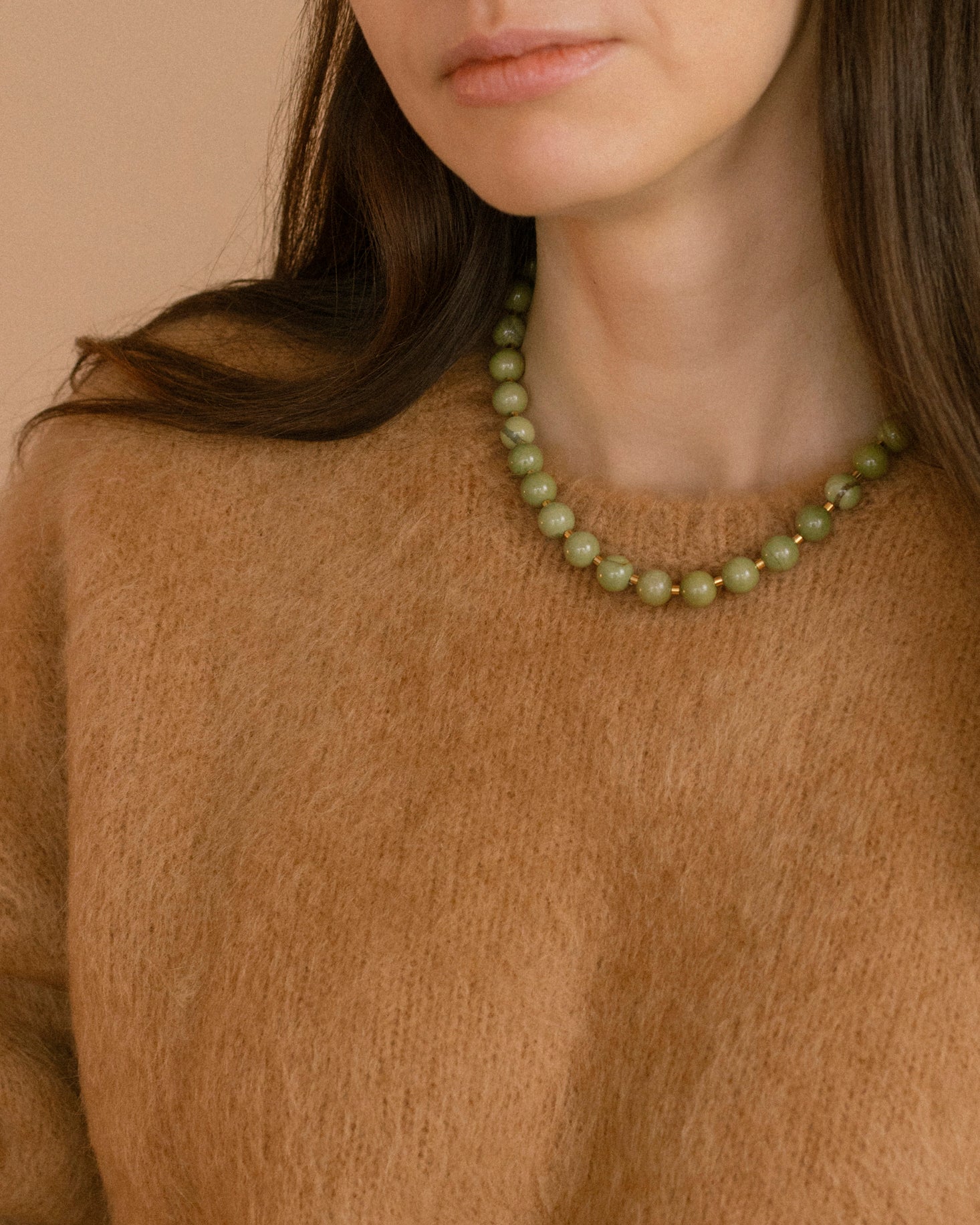 Olivia Necklace styled on model with polished olive-green agate beads and gold-plated cubic zirconia clasp, adding elegance to everyday outfits.