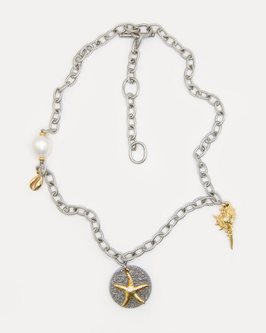 Sea Gifts Necklace with bold silver chain, freshwater pearl, golden shell, starfish and snail charms - a playful mixed metal jewelry piece with coastal charm.