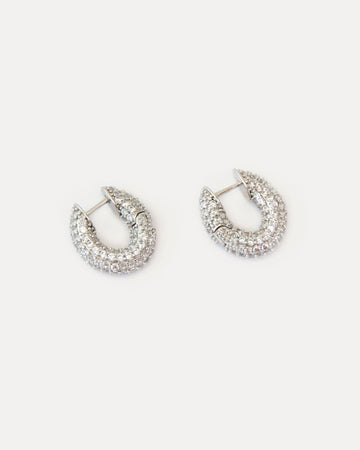 Mini hoop earrings with clear cubic zirconia on silver-tone brass. Crystal Sparkles earrings add refined shine and modern elegance to any look.
