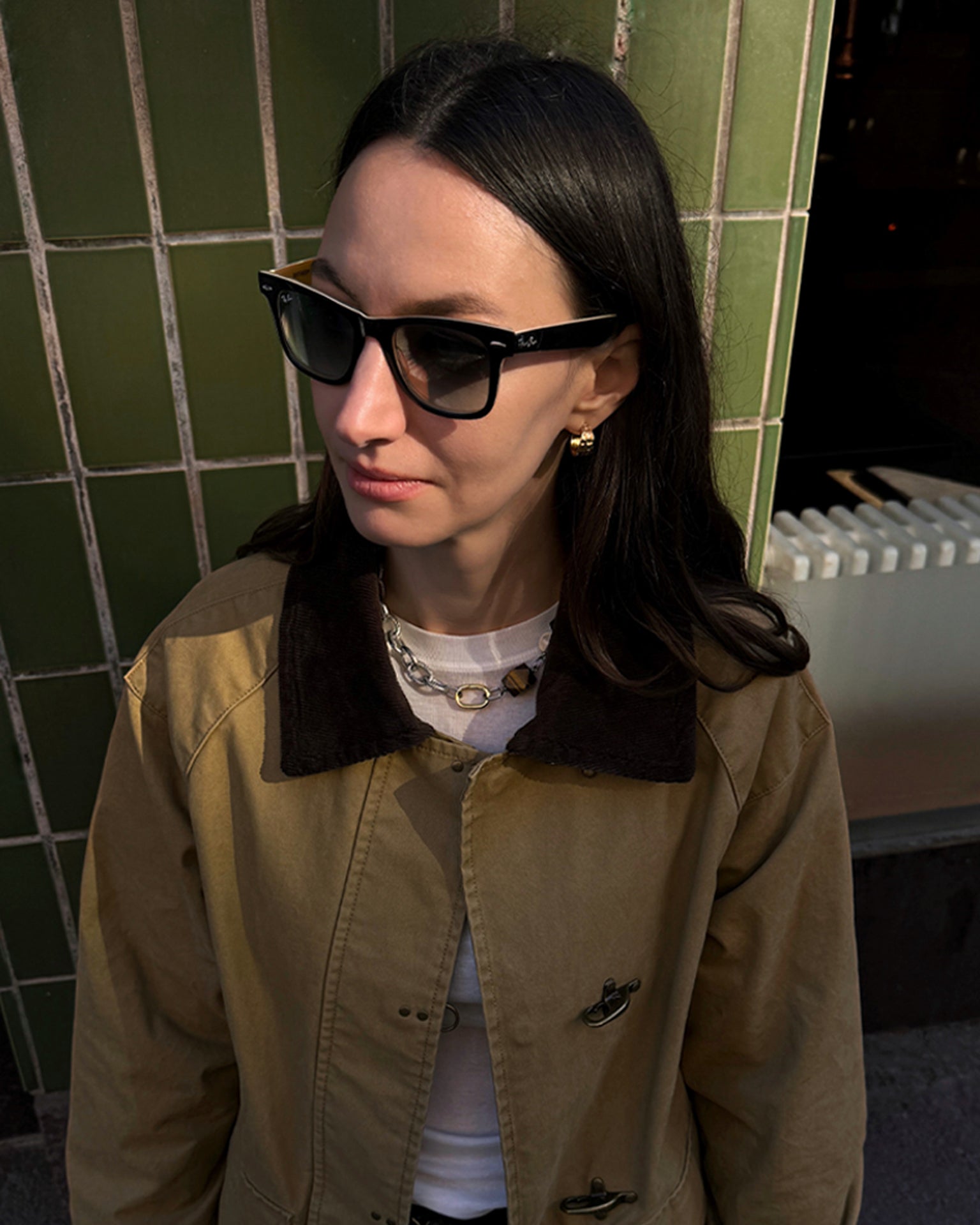 Tiger Eye Necklace styled in street look with sunglasses and beige jacket, featuring tiger eye, agate, clear quartz, and mixed metal chain accents.