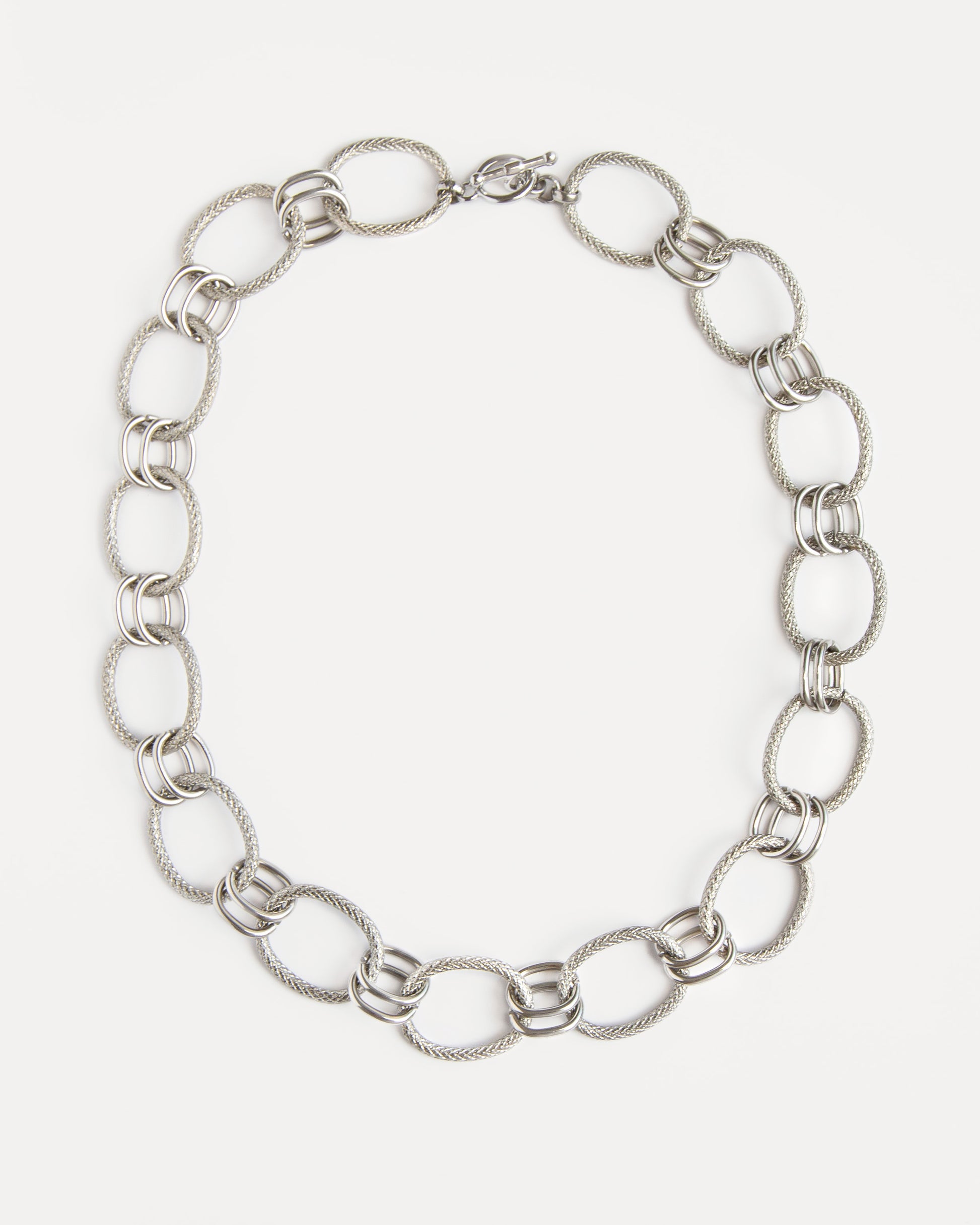 The Venus Necklace in polished stainless steel with sculptural twisted links — a timeless statement chain that feels modern and refined.