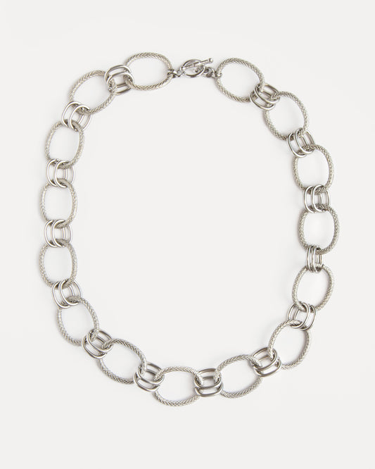 The Venus Necklace in polished stainless steel with sculptural twisted links — a timeless statement chain that feels modern and refined.